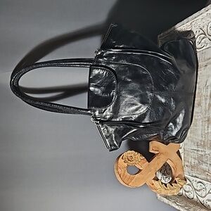 Hobo-The Original Black Leather Zippered Shoulder Bag.